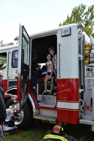 Residents exploring the fire truck.